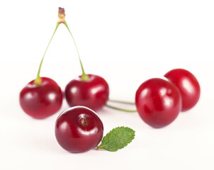 Wall Mural - Ripe fresh red cherry isolated on white background.