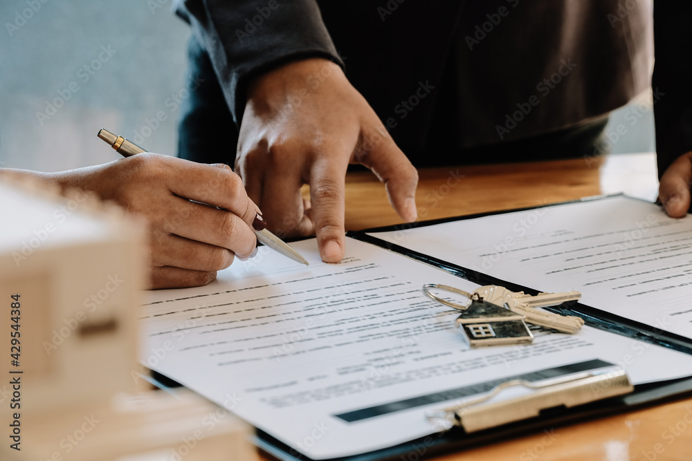 Real estate agent offer hand for customer sign agreement contract signature for buy or sell house. Real estate concept contact agreement concept - obrazy, fototapety, plakaty 