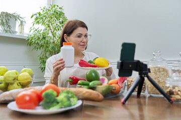 Female nutritionist telling her followers about healthy food, nutritional supplements