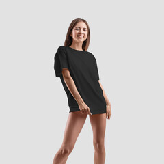 Wall Mural - Black t-shirt mockup on young sexy girl isolated on background