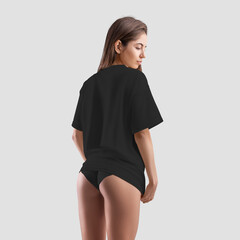 Wall Mural - Black t-shirt mockup on young sexy girl in panties isolated on background