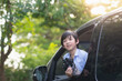 © lalalululala - child holding binoculars out of the car window on summer day