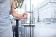© zinkevych - Male hand holding doorknob inside cafe