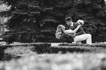 Wall Mural - Newlyweds walk around city.