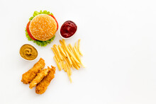 Fast Food Flat Lay Set. Burger With Fried Potatoes And Chicken, Top View
