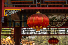 Traditional Asian Red Lantern Hanging On A Chinese Gazebo