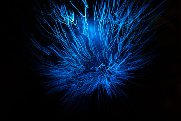 Wall Mural - blue abstract particles and lines with bokeh and blur in dark background.