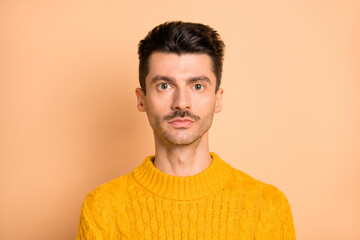 Wall Mural - Photo portrait of serious man with mustache wearing bright yellow sweater isolated on pastel beige color background