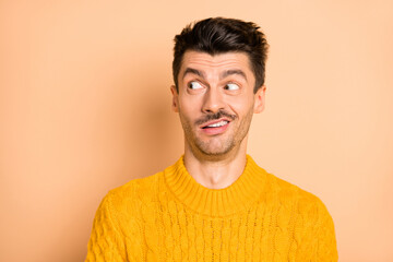 Wall Mural - Photo of crazy unhappy shocked man look empty space dislike news face isolated on pastel beige color background
