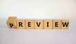 Preview or review symbol. Turned the cube and changed the word 'preview' to 'review'. Beautiful white background, copy space. Business, preview or review concept.