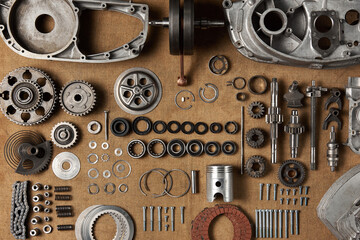 Top view of a complete set of parts for a vintage motorcycle engine
