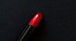 Open red lipstick for fashion make-up on dark background