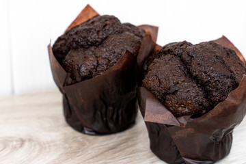 Chocolate cupcake, home bakery on a light background