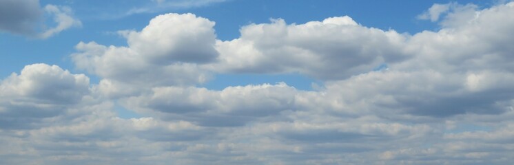 Wall Mural - panoramic view of blue sky with beautiful cloudscape, natural clouds background