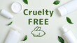 Frame of organic cosmetics containers and green leaves. Cruelty free beauty products. No animal testing.