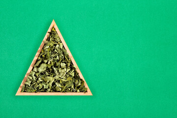 Sticker - Moringa oleifera - Dried moringa leaves in a triangular bowl