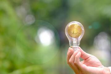 Poster - Energy saving light bulb and bitcoin cryptocurrency coin and business or finance money concept