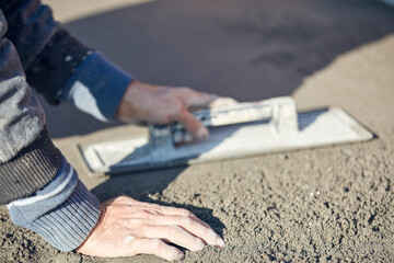 Wall Mural - Real construction worker working on a house renovation - authentic person on the job.