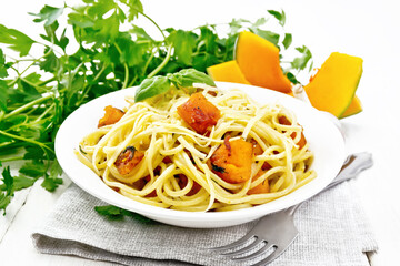 Wall Mural - Spaghetti with pumpkin in plate on board