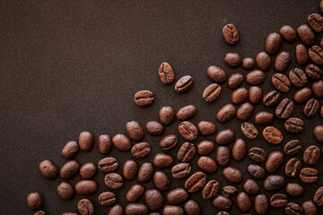 close up of roasted coffee beans on black background 