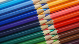 Fototapeta Tęcza - Colorful row of colored pencils sharp facing each other, Pattern background