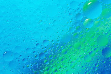  oil with bubbles on light blue turquoise monochrome background. Abstract space background. Soft selective focus. macro of oil drops on transparent gel surface. copy space. air bubbles in water,