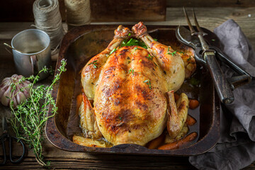 Wall Mural - Roasted chicken with herbs. Roasted chicken with thyme and garlic.