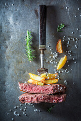 Wall Mural - Red steak and golden fries. Medium rare steak.