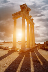 Wall Mural - Architectural columns from the times of ancient greece. Ruins against the sunset sky. Side turkey
