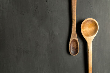 Wall Mural - Black Background Wooden Spoon