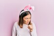 © Krakenimages.com - Young beautiful woman wearing cute easter bunny ears feeling unwell and coughing as symptom for cold or bronchitis. health care concept.