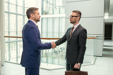 Canvas Print - Successful businessmen shaking hands