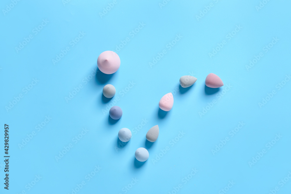 Makeup sponges on color background