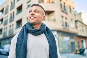 Wall Mural - Young caucasian man smiling happy walking at the city.