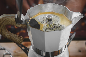 Coffee making with Moka pot and snack.