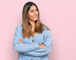 © Krakenimages.com - Young woman wearing casual clothes looking to the side with arms crossed convinced and confident