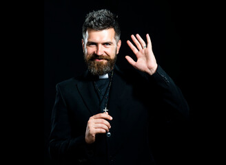 Portrait of priest with pray. Monk man oblation. Senior religion holy male with a confident expression. Isolated on black.