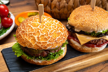 Tasty vegetarian cheeseburgers and hamburgers with round patties or burgers made from grains, vegetables and legumes