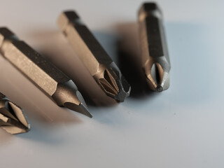 Poster - Closeup shot of curly screwdrivers isolated on a white surface