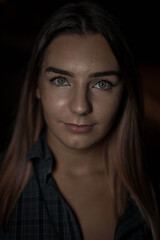 Poster - Closeup shot of a beautiful Caucasian woman with blonde hair wearing flannel