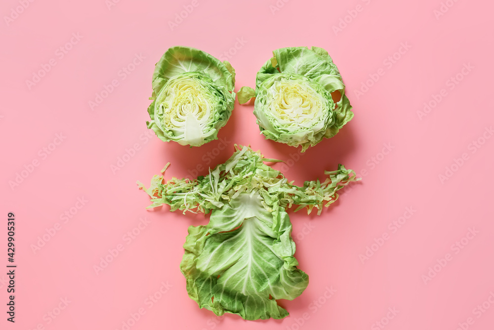 Composition with fresh cabbage on color background