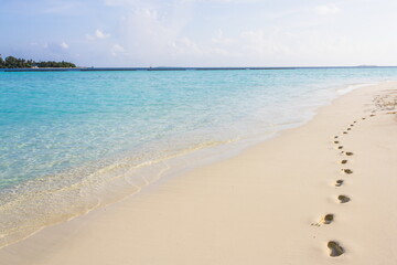 Azure water in the lagoon of the tropical island in the Maldives