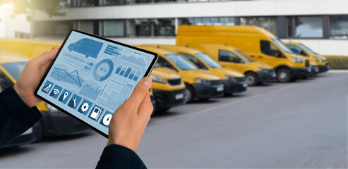 Poster - Manager with a digital tablet on the background of vans. Fleet management	