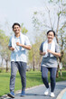 © Thirawatana - Couple doing exercising by running in the garden. Sporty mature couple styaing fit with sport.