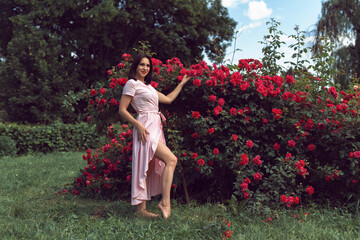 Wall Mural - Young woman in spring park