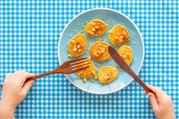 Canvas Print - Miniature pancakes and milk glass on rustic background. Breakfast ideas for kids.