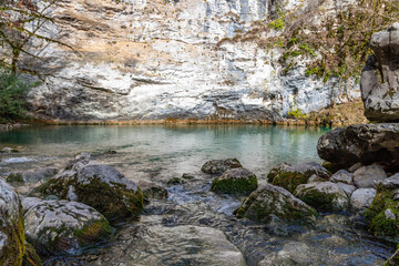 Wall Mural - Blue lake on the road to Ritsa lake. Small lake with emerald water color on the right bank of river Bzyb. Abkhazia