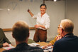 © Jacob Lund - Manager giving business presentation to colleagues