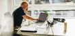 © Jacob Lund - Businessman talking over phone while working on laptop