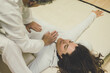 © Fabio Principe - Therapist man doing a Shiatsu massage to a woman. Holistic therapy,  treatment with manipulation by thumb, fingers and palms. Wellness, health, relax, well-being and alternative medicine concept.